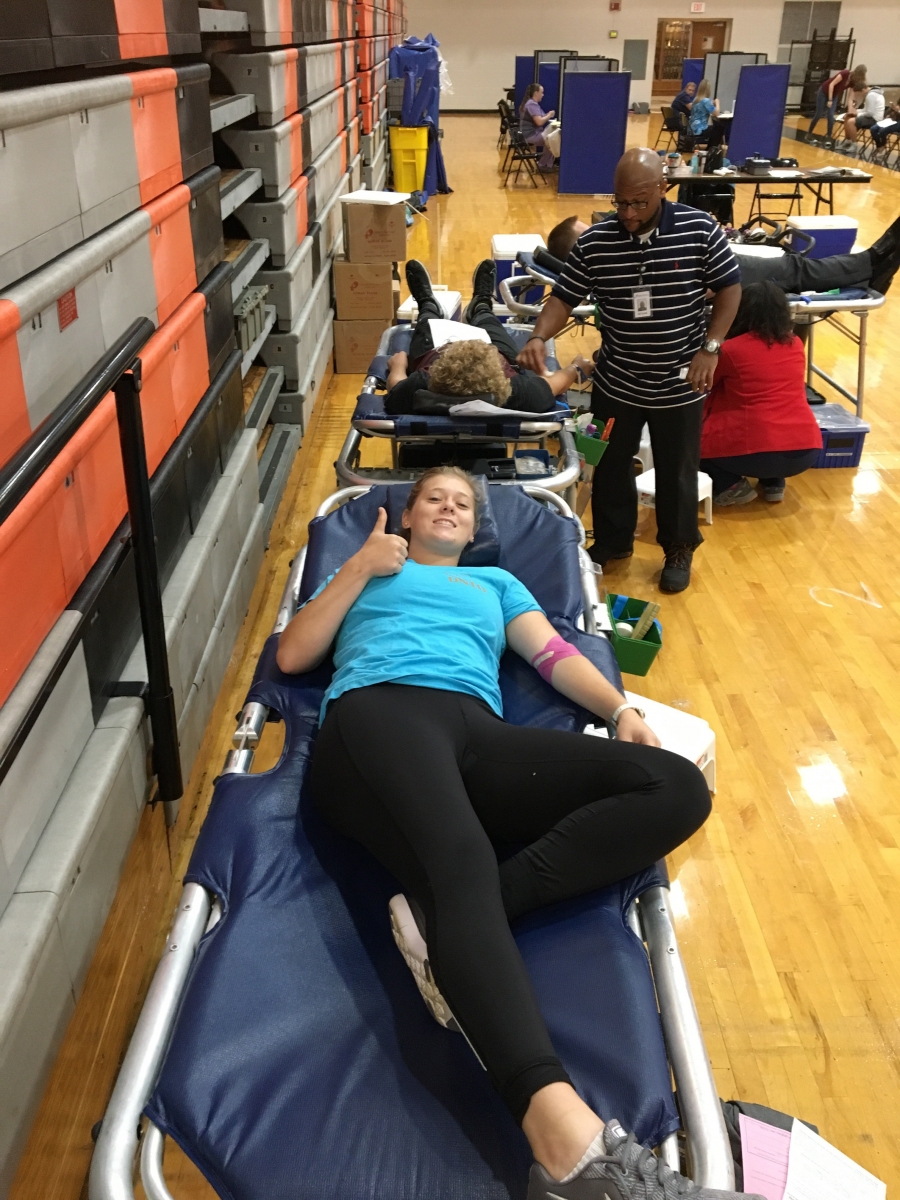 girl on cot with blood draw